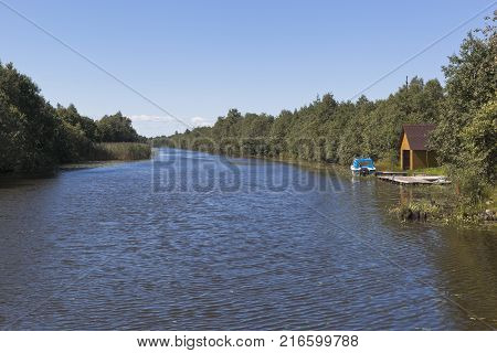 View from the Krohinskogo bridge on Belozersky bypass channel in the Vologda region, Russia