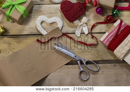 Piece Of Kraft Paper And Three Flowers Of Different Colors