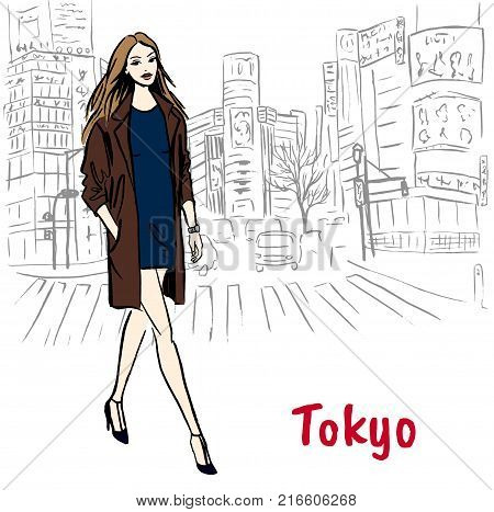 Woman with shopping bags walking on street in Shibuya, Tokyo, Japan