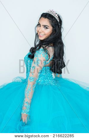 Hispanic teenage girl wearing a dress for a dance
