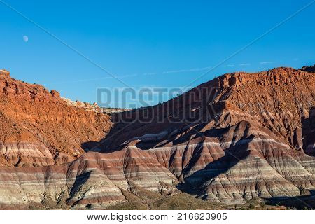 a full moon rising over the scenic landscape int he escalante grand staircase national monument Utah