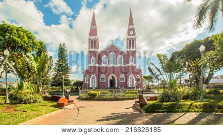 Costa Rica January 2015 tourists visit this neogothic building entirely built in iron for its particular architecture. It is located in the village called Greece a few kilometers from the capital