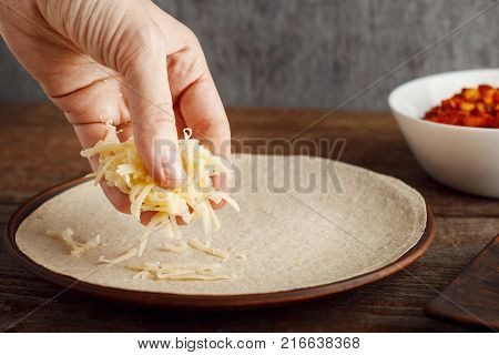 Making of tortilla for quesadilla, cooking for healthy fresh quesadilla, tacos, buritto, fajitas. The concept of national cuisine, healthy fast food
