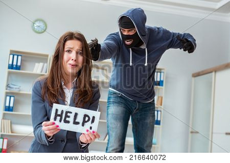 Criminal taking businesswoman as hostage in office