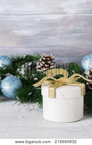 festive beautiful christmas background with gift boxes balls and christmas tree branches on white wooden background copy space