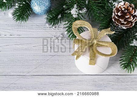 festive beautiful christmas background with gift boxes balls and christmas tree branches on white wooden background copy space