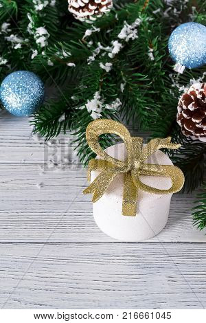 festive beautiful christmas background with gift boxes balls and christmas tree branches on white wooden background copy space