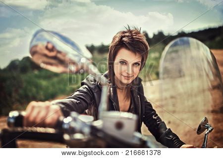 Cheerful Muscular Woman Posing On Motorcycle