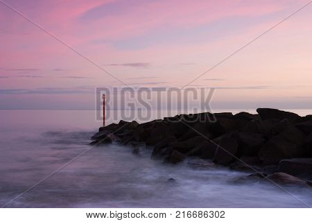 Sunset in West Bay Dorset England. The area is part of the Jurassic Coast a World Heritage Site.