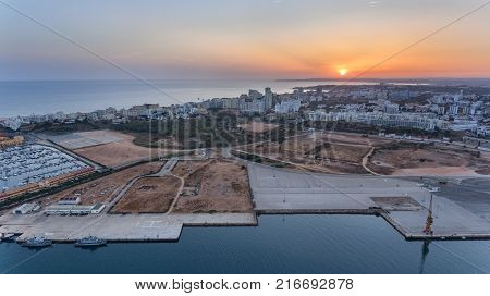 Aerial. Ferragudo at sunset shooting from the sky with drone. Portimao