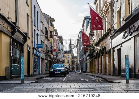 Cork, Ireland - November 12, 2017: Oliver Plunkett street in Cork. It is typical shopping street in the center of Cork