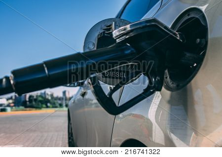 Petron pump inserted to the gas hole of the modern car