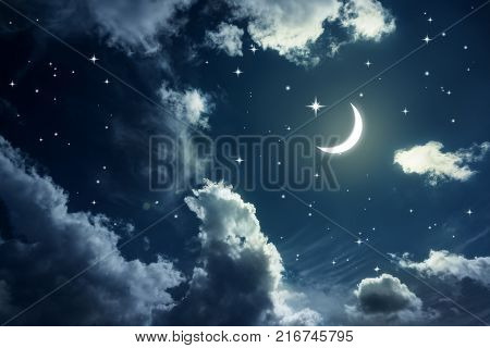 Night sky with stars and moon and clouds