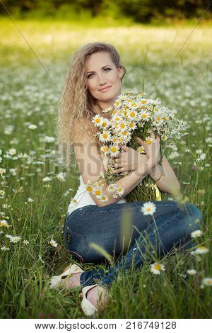 Beautiful Lady With Cute Daughter On Camomile Field Full Of Flowers
