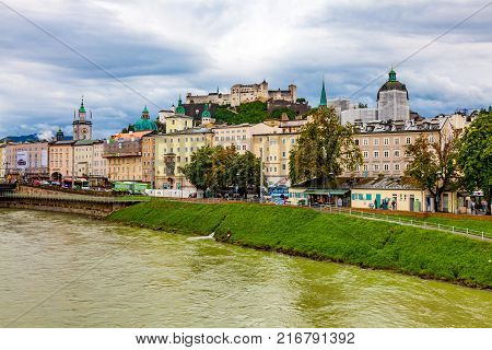 Salzburg Austria - August 8 2011 : View of cityscape of Salzburg in Austria with Festung Hohensalzburg and river Salzach