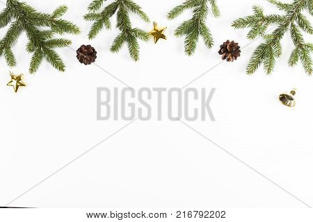 Christmas background with fir branches, pine cones on white background.