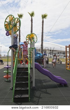 Adler, Krasnodar region, Russia - July 8, 2016: Children play on the playground in the Olympic Park near the Olympic Stadium 