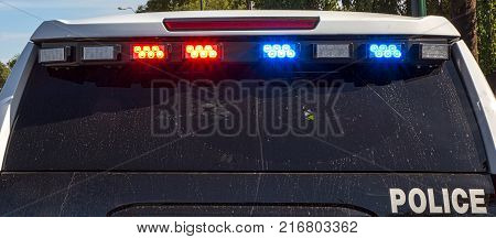 Flashing lights on Police vehicle rear view