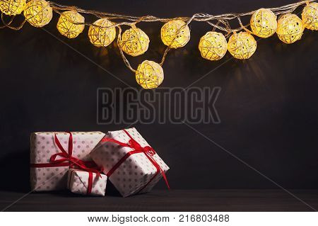 Luminous Christmas gerland on a dark background. Copy space.Christmas New Year's background.Christmas card