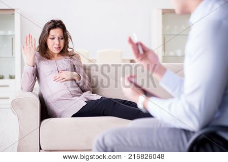Pregnant woman visiting psychologist doctor