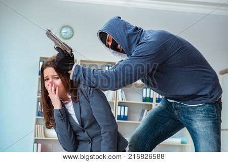 Criminal taking businesswoman as hostage in office