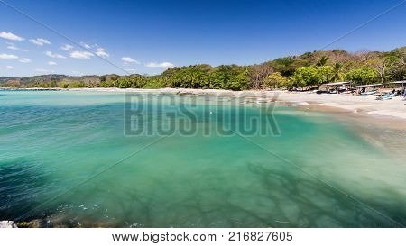 Samara beach Costa Rica with white sand and lush vegetation
