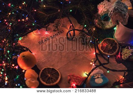 Letter for Santa on decorated chrismas background with gingerbread coocies and garland