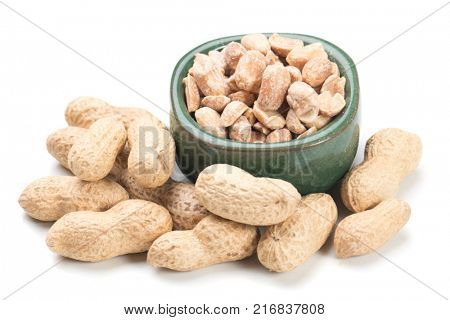 Roasted peanuts with peanut shells isolated on white background