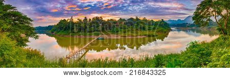 Beautiful view of a bamboo bridge. Luang Prabang. Laos landscape. Panorama