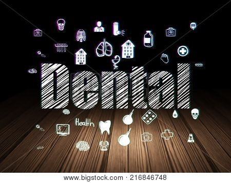 Medicine concept: Glowing text Dental,  Hand Drawn Medicine Icons in grunge dark room with Wooden Floor, black background