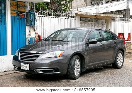 Acapulco Mexico - May 31 2017: Grey motor car Chrysler 200 in the city street.