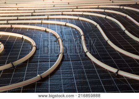 Construction of house. Tubing are elements of radiant floor heating system
