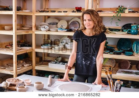 Clay bowl author decorating, pottery making decor