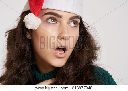 woman looking up with her mouth open, portrait, winter, new year.