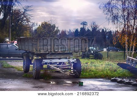 hindcarriage for tractor at autumn rain background