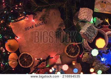 Letter for Santa on decorated chrismas background with gingerbread coocies and garland