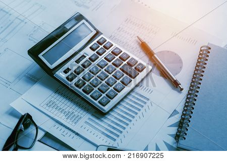 business accounting concept financial with calculator pen notbook on desk