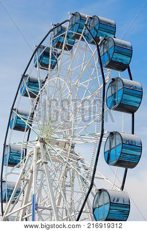 Modern blue ferris Wheel on Blue Sky