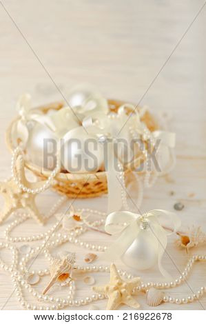 Christmas and New Year. Christmas tree white toys with ribbon. Selective focus.
