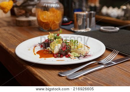 Venison fillet and potato puree served on bar counter, close-up