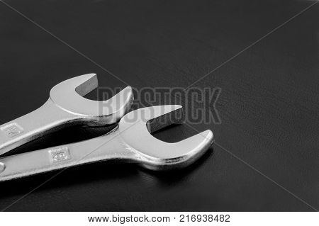 Two fork wrench is on black background