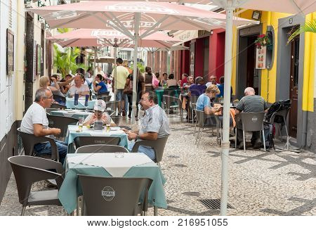 FUNCHALMADEIRA PORTUGAL SEPTEMBER 8 2016: Zone Velha - the oldest district famous for its best restaurants and cafes in Funchal. Madeira Portugal