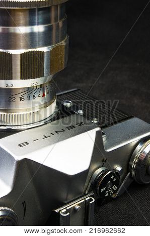 DONETSK, UKRAINE - May 07, 2016: old soviet film SLR camera Zenit - B with lens Jupiter-11, for use with 35 mm film, made in USSR in 1968 - 1973, manufactured by KMZ, with original leather case