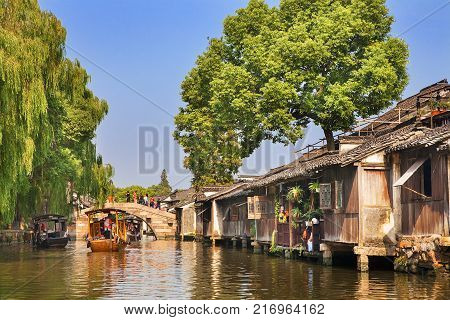 Wuzhen, China - June 24, 2016: Wuzhen a famous scenic historic water town in China. Wuzhen is part of Tongxiang, located in northern Zhejiang Province, China.