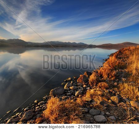 Beautiful lake reflections with nice blue sky and clouds