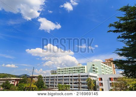 A dormitories and mountain with a sky and clouds in summer.