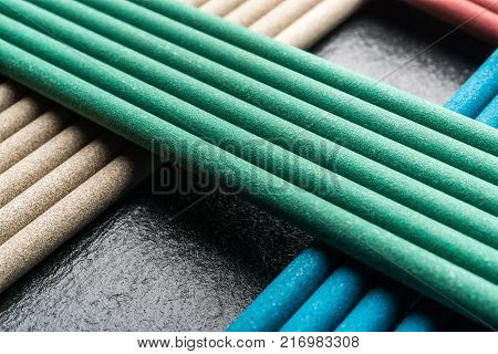Electrodes for welding, on a black background