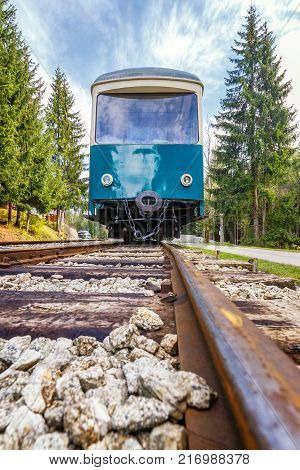 Passenger railway wagon from a low perspective from the rail.
