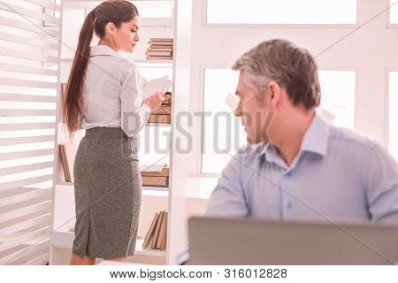Gray-haired Man Looking At His Colleague Dress