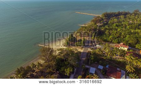 Beautiful Coastal View Of Wide Tropical Beach With White Sand,coconut Trees And Azure Water On Pohon